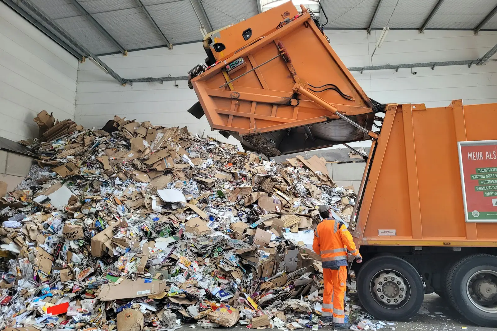 Load of mixed debris being tipped at a sorting facility