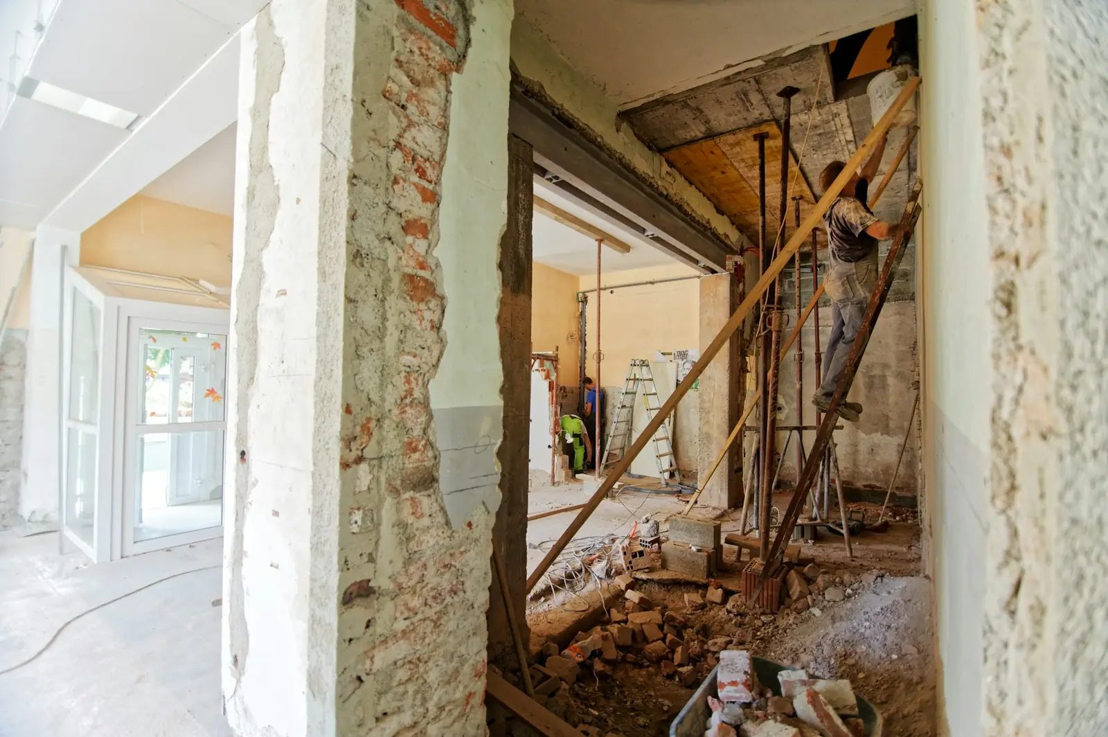 Interior walls opened up to the wood lath behind old plaster