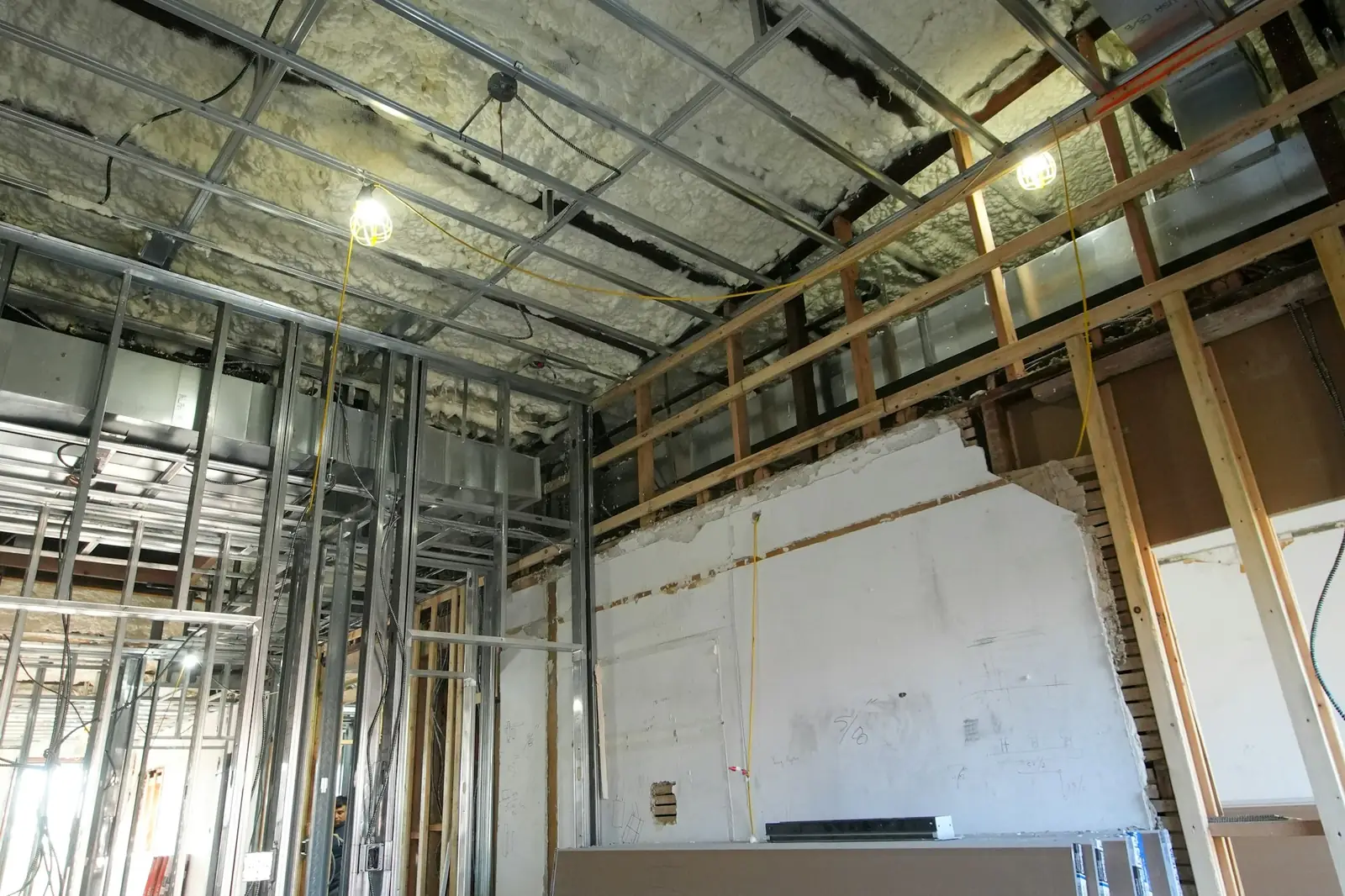 Building interior with steel studs and insulation exposed